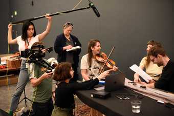 Musicians rehearse for a performance of Tony Conrad’s Ten Years Alive on the Infinite Plain 1972