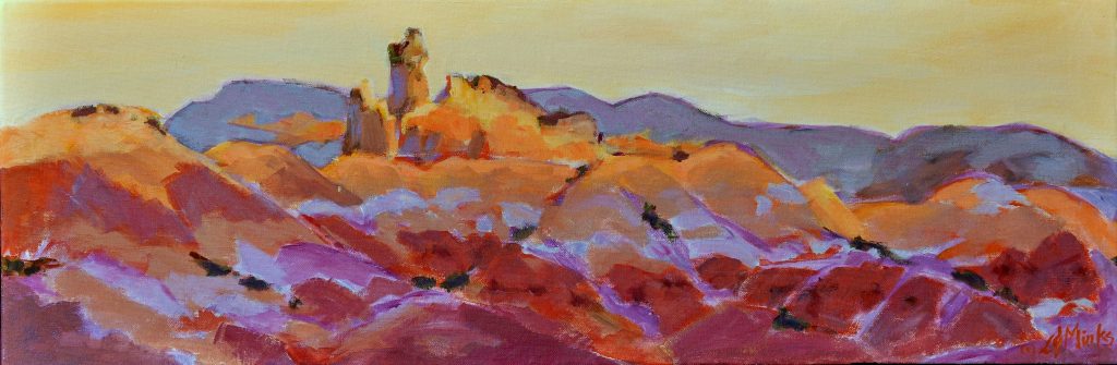 A painting of rocky southwestern mountains at sunset