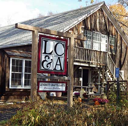 The front of the Leverett Crafts and Arts Center, alarge old barn-style building in Leverett, Massachusetts