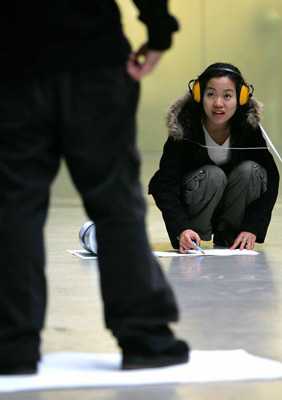 Teenagers doing the Making your Mark activity at Tate Modern