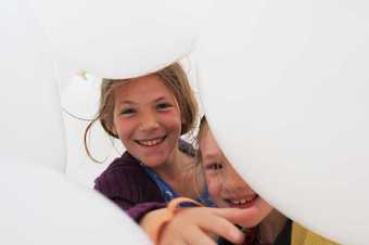 Schoolchildren enjoying Martin Creed Half the Air in a Given Space 2011 at the Tate St Ives Summer Exhibition