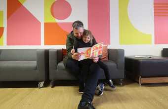 A man and his daughter use the sketchbook at Tate Liverpool