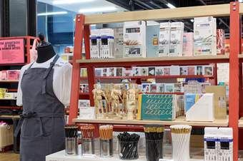 Items in the Turbine Hall shop at Tate Modern, including books and an apron