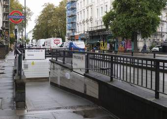 Entrance to Pimlico tube station with red underground sign