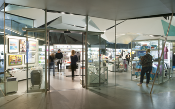 A glass entrance to a small shop